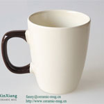 White wide mouthed ceramic coffee mugs with black handle
