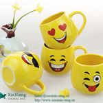 Yellow egg-shaped funny smiling face ceramic coffee mugs