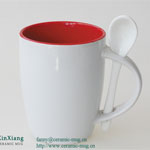 White wide mouthed printed ceramic coffee cup with spoon