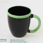 Large black printed ceramic coffee mugs with green handle