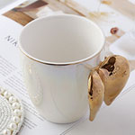 Cheap white pearl glazed ceramic mugs with wing shaped handle china manufacturers